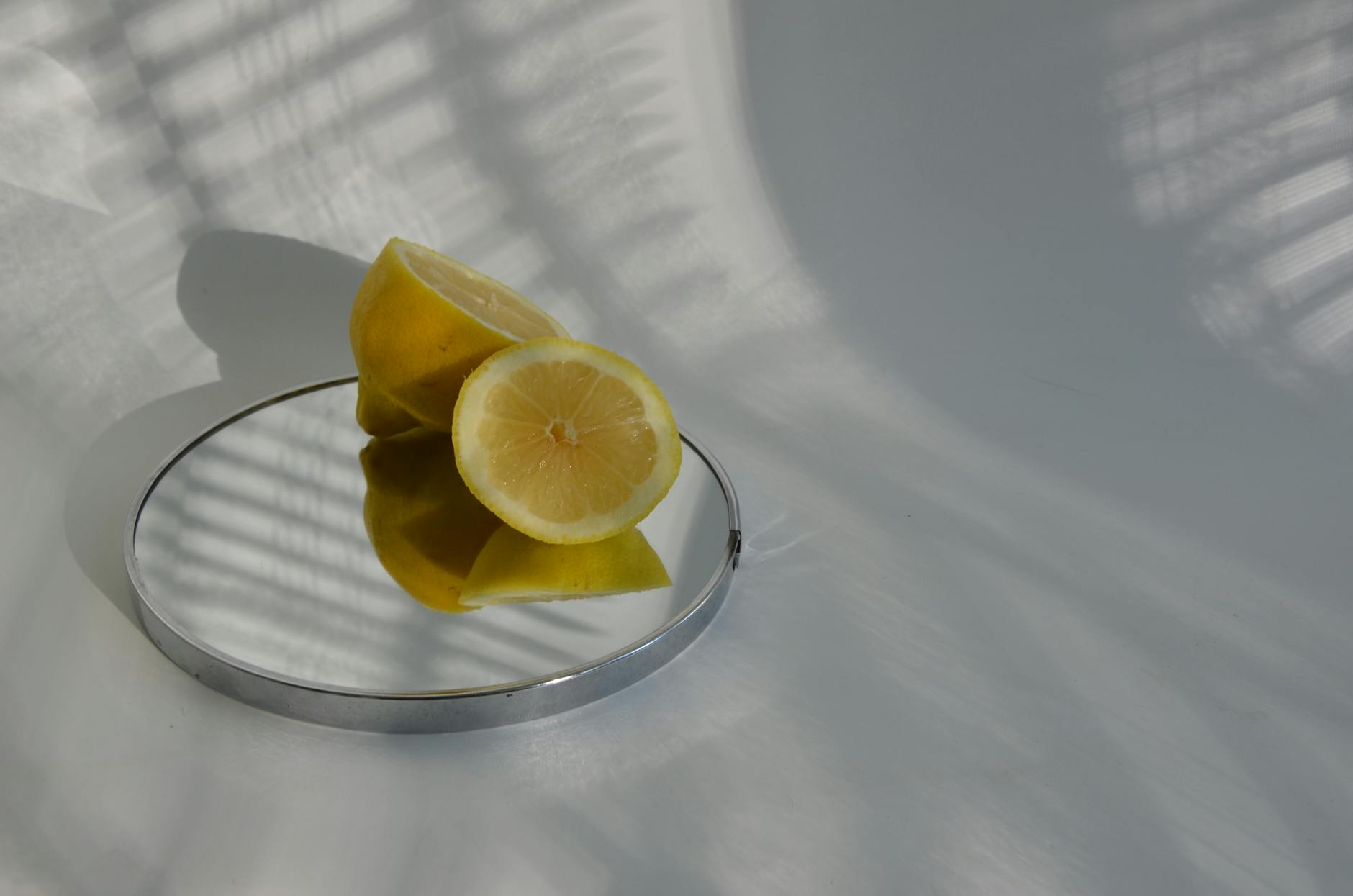 Yellow vibrator surrounded by peeled bananas and fruit on bright yellow background, symbolizing playful self-care